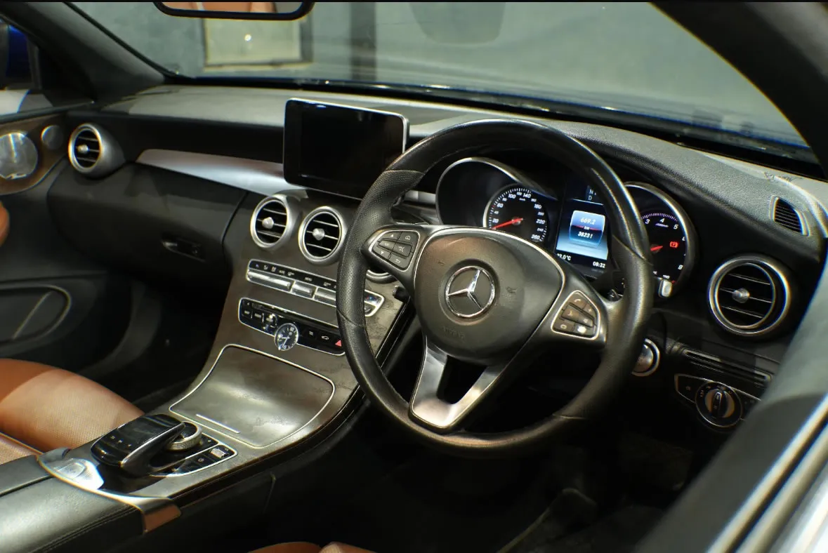 Plush interior of the Mercedes Benz C-Class Cabriolet, a top choice for luxury car hire in Goa.
